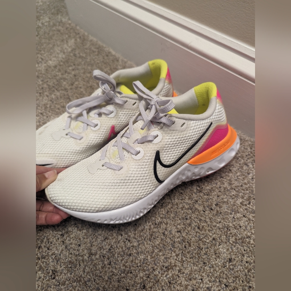 Nike White Athletic Shoes with Black, Pink, and Yellow Accents